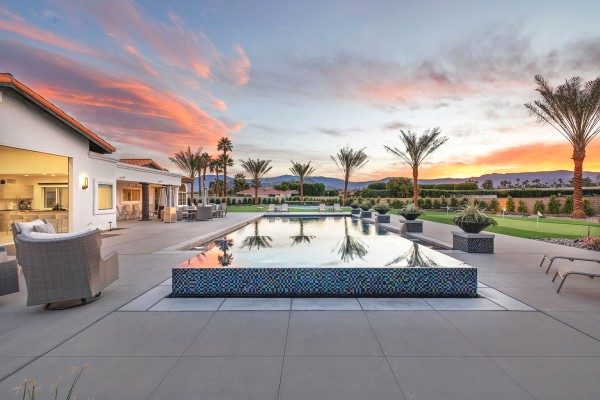 Modern home with pool at sunset in the hills