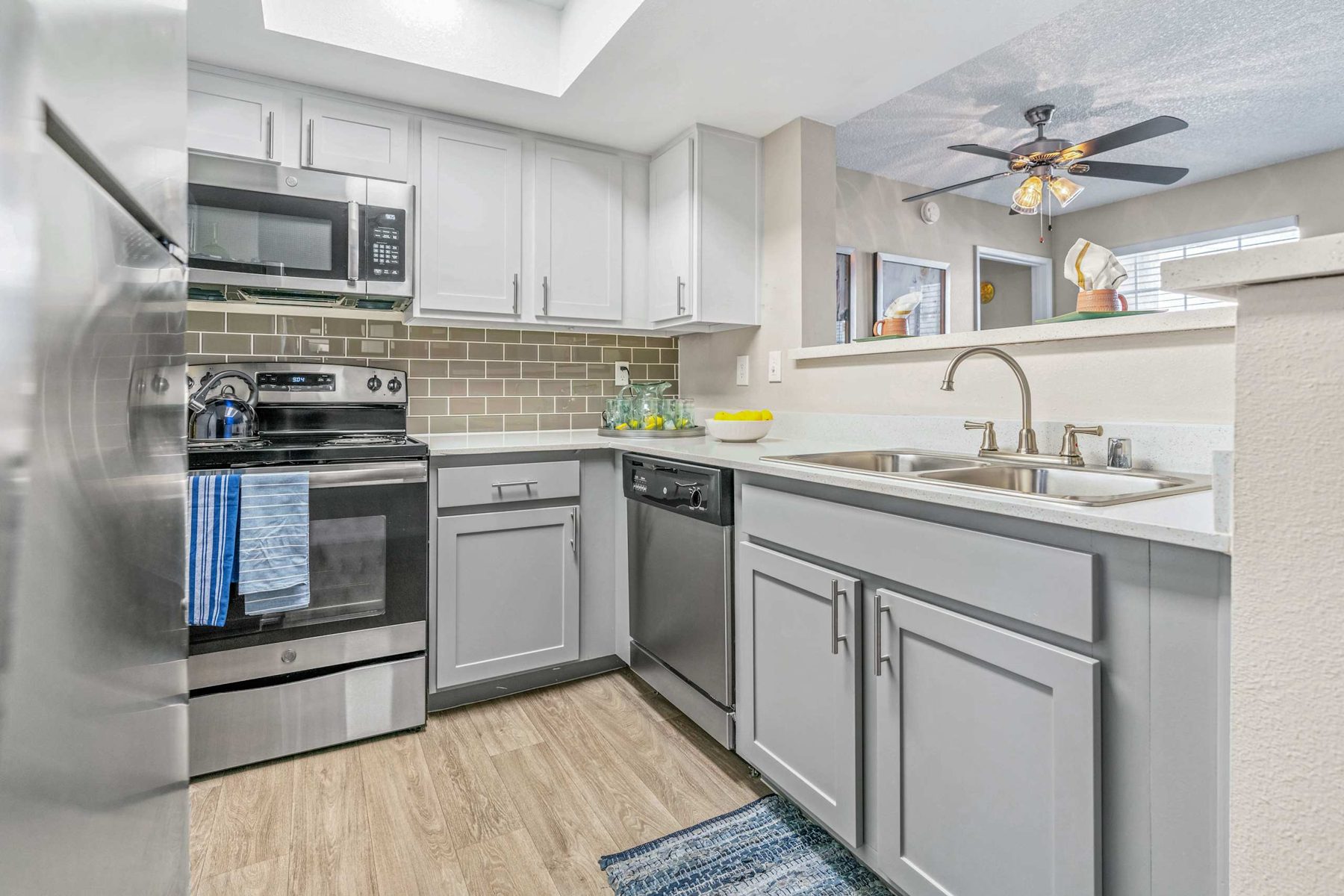 White kitchen with stainless appliances